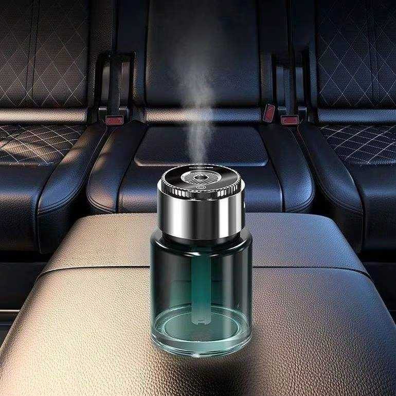 Auranza Cart smart car perfume diffuser releasing mist on a car seat for fresh fragrance